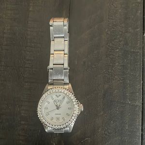 Beautiful Roxy watch... silver with stone around bezel .. women/ girls